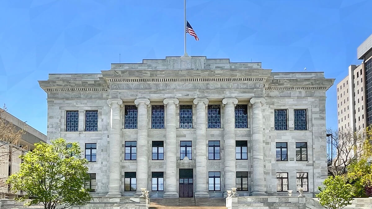 Harvard Hit with Class Action After Former Manager Indicted for